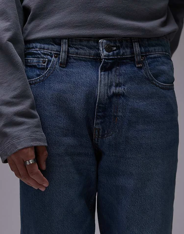 Mango Tapered Fit Jeans In Mid Blue For Men 7 Mango Tapered Fit Jeans In Mid Blue For Men - Image 5